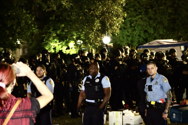 Police stand in front of protesters early Wednesday morning. 